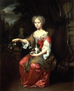 Portrait of a Lady holding her pet King Charles Spaniel