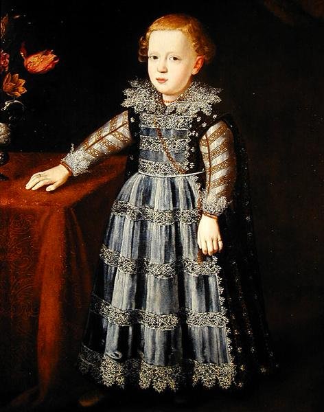 Portrait of a Child Standing by a Table