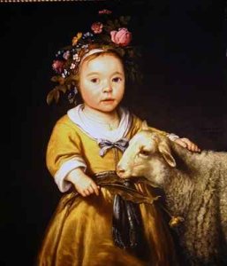 Portrait of a girl with a lamb