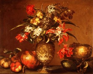 Tulips, a carnation and other flowers in a silver gilt vase with fruit on a ledge