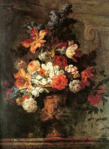 Still life of flowers in a gold vase resting on a marble ledge