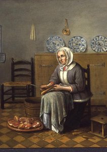 A Seated Woman preparing Food in a Kitchen