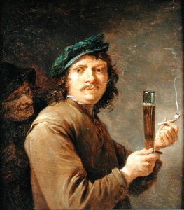 Man Holding a Pipe and a Glass of Beer