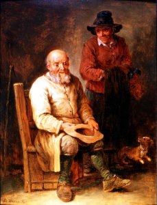 A man seated with a woman by his side and a dog at their feet