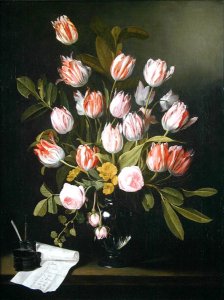 Tulips, yellow and pink roses in a glass vase