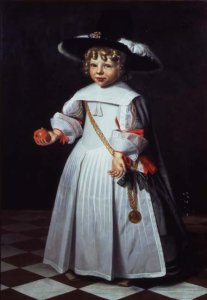 Portrait of a young child holding an orange